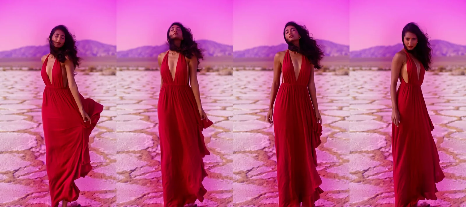 Quattro fotogrammi di una donna adulta con lunghi capelli neri in un abito halter di seta rosso ruggine su una distesa di sale bianco crepata al tramonto sotto un cielo magenta, con l'abito e i capelli mossi di lato dal vento mentre si volta verso il vento e poi guarda la camera da sopra la spalla.