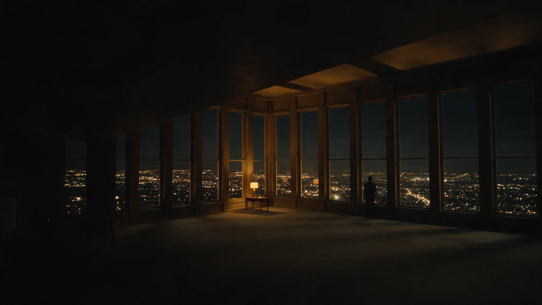 Copertina di Wan 3.0 Prime: una stanza buia con una parete di finestre alte su una città che luccica di notte, una sola piccola figura contro il vetro