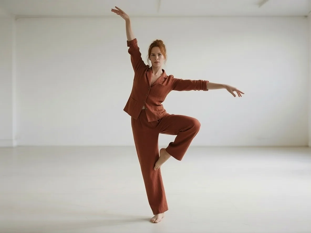The woman from the salt flat re-posed into a one-legged dance stance, but placed in the white studio of the pose photo